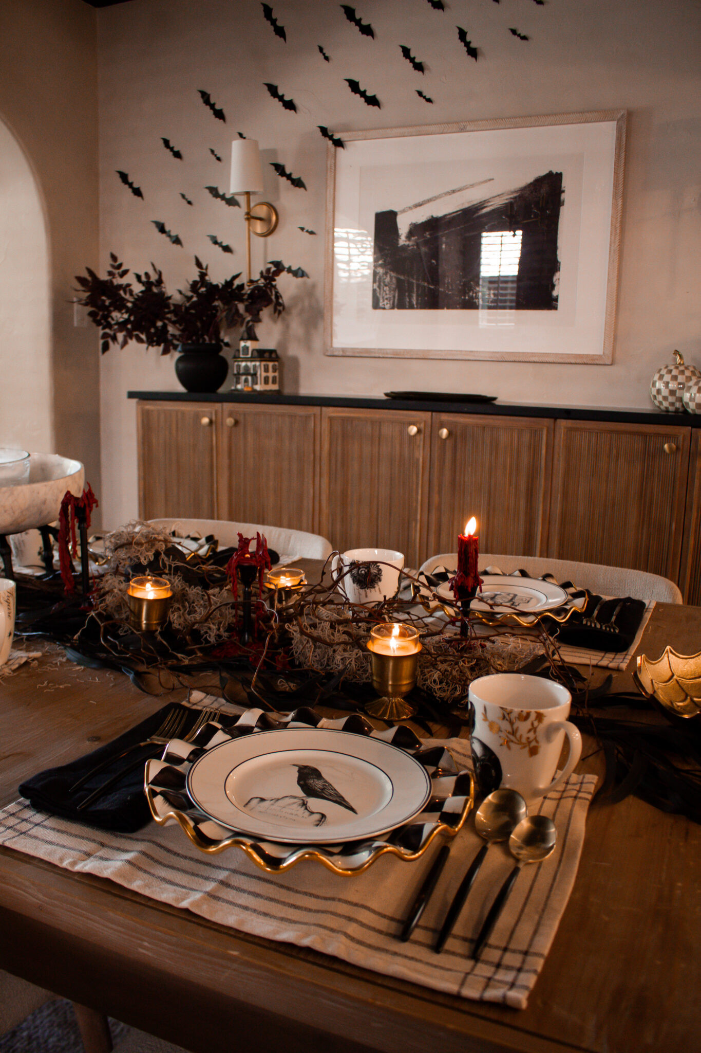 October entertaining, but with a darker twist. 🕯️ Love how the black accents, candlelight, and subtle spooky details completely transform this table for Halloween.

#LTKHome #LTKSeasonal