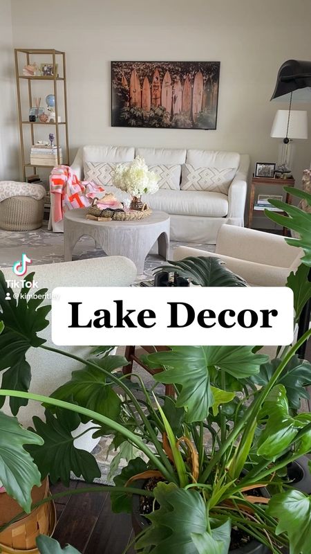 Living room decor at the lake house. 
kimbentley, slipcover sofa, open shelving, drapery, swivel boucle chairs, coffee table, coffee table books, throws, area rug, anthro

#LTKparties #LTKVideo #LTKCyberWeek
