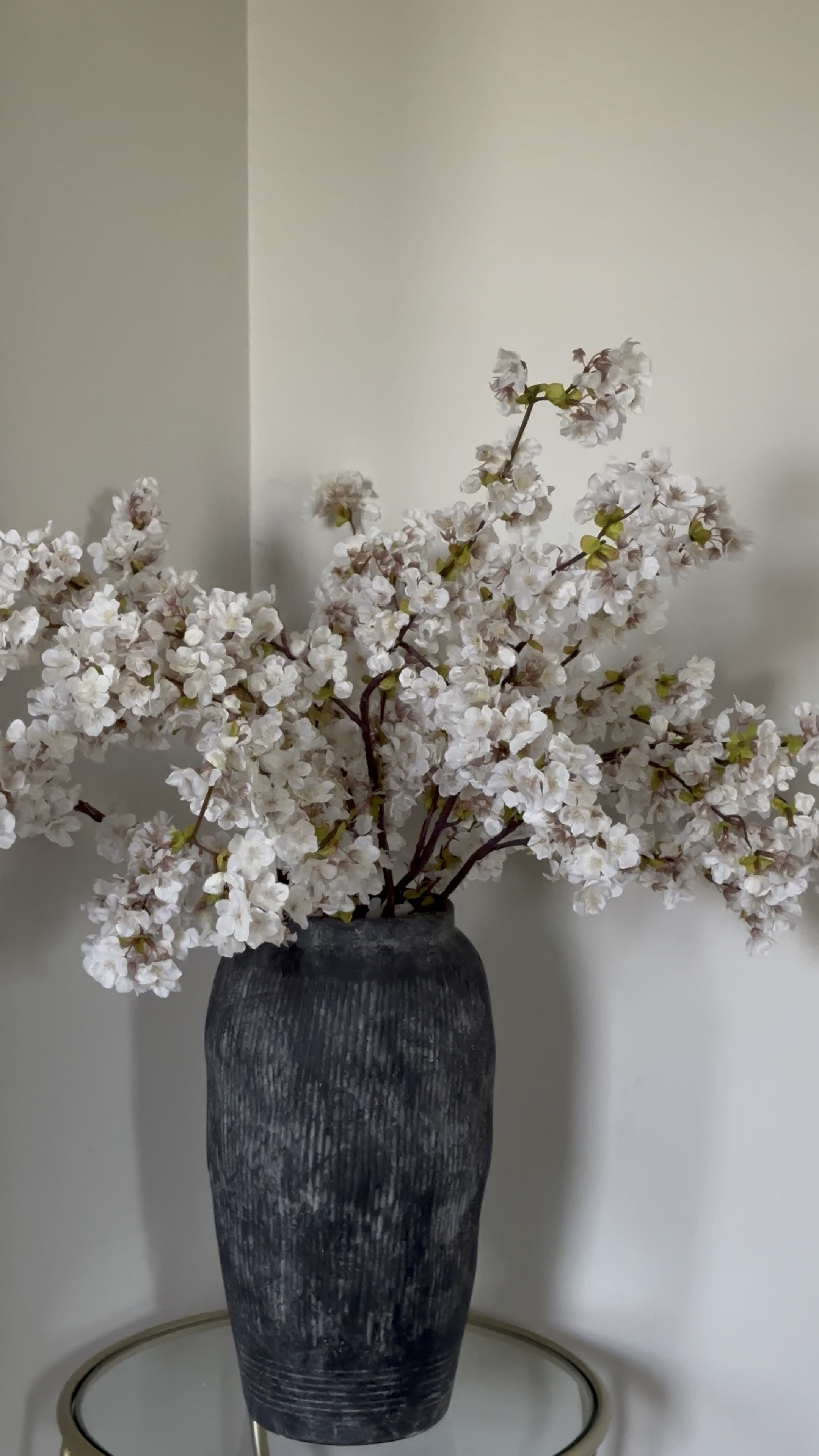 Spring ivory colored cherry blossoms in a black vase 

#LTKHome #LTKSeasonal