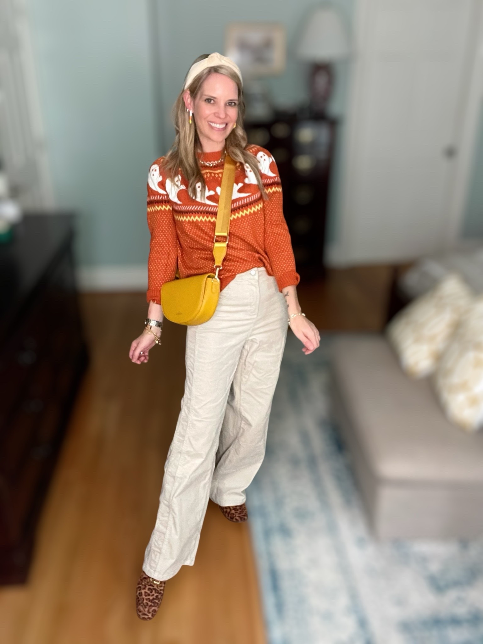 👻 Festive & cozy for fall! I styled this orange ghost sweater with wide-leg cream pants and leopard print mules for a playful yet chic take on Halloween style. I added my favorite yellow crossbody bag, candy corn earrings, and a neutral headband for a fun pop of seasonal flair. 🍂✨

This is such an easy outfit for October outings, pumpkin patches, or a casual Halloween get-together. The mix of cozy knits, statement accessories, and a touch of leopard makes it feel elevated while still festive. 🧡

ghost sweater Amazon, Halloween outfit inspo, cozy fall sweater, festive fall outfit, casual October style, pumpkin patch outfit idea, leopard print mules, Amazon Halloween sweater, chic spooky season outfit, fall fashion 2025


#LTKFindsUnder50 #LTKItBag #LTKShoeCrush