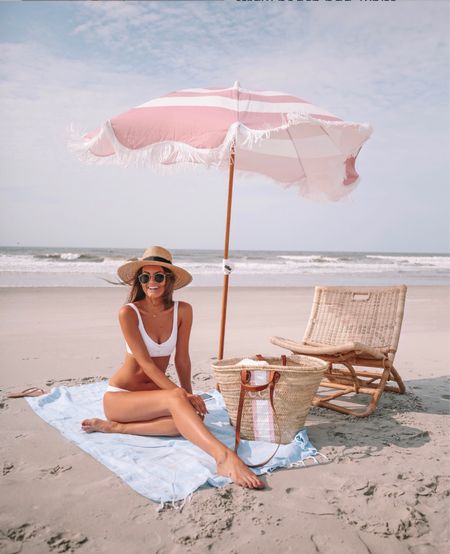Beach vacation essentials! 💕☀️ beach umbrella, beach blanket, rattan chair, straw beach bag, white bikini, brixton straw hat, ray-ban sunglasses 
