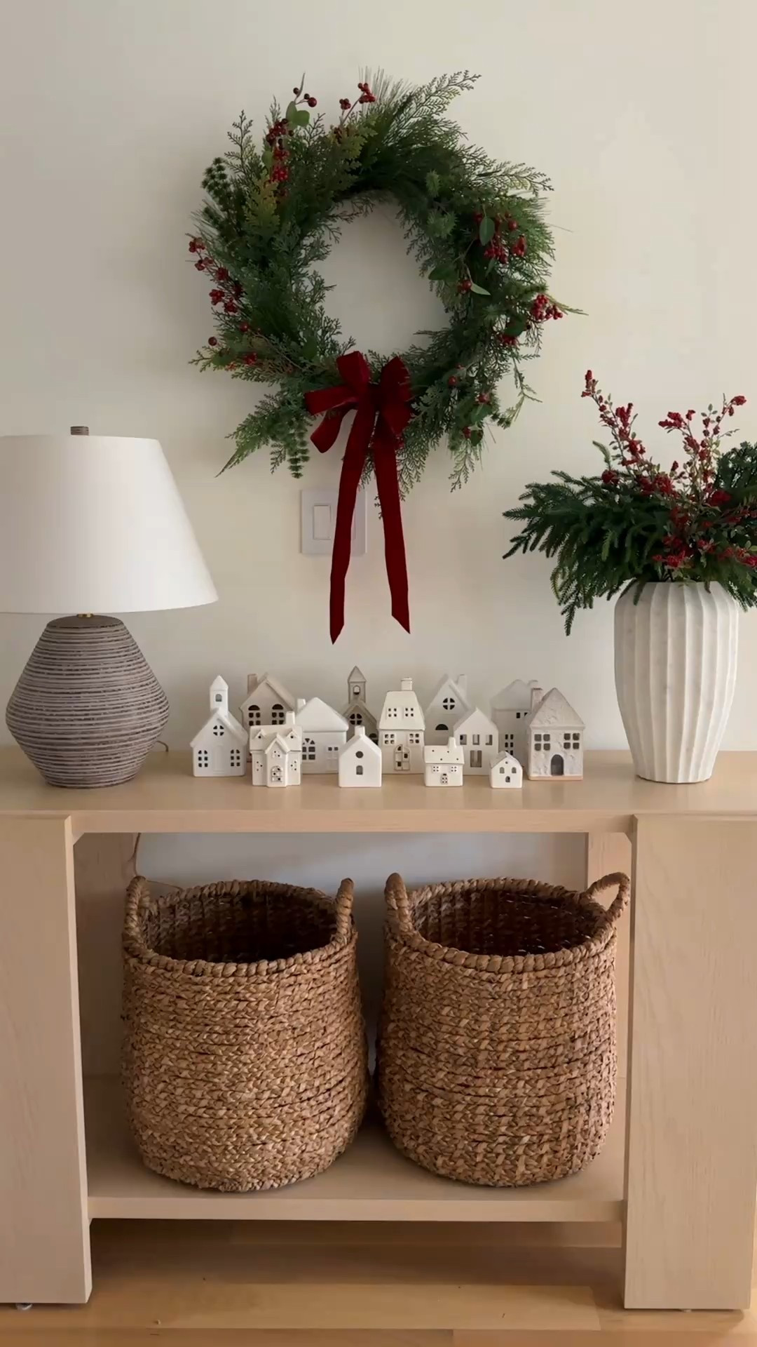 Hang the wreath inside so you can admire it! Styled the Christmas village houses that I’ve been collecting on my console table. Hidden in my woven baskets is dirty laundry and toys! Shhhh

#LTKCyberWeek #LTKHome #LTKHoliday