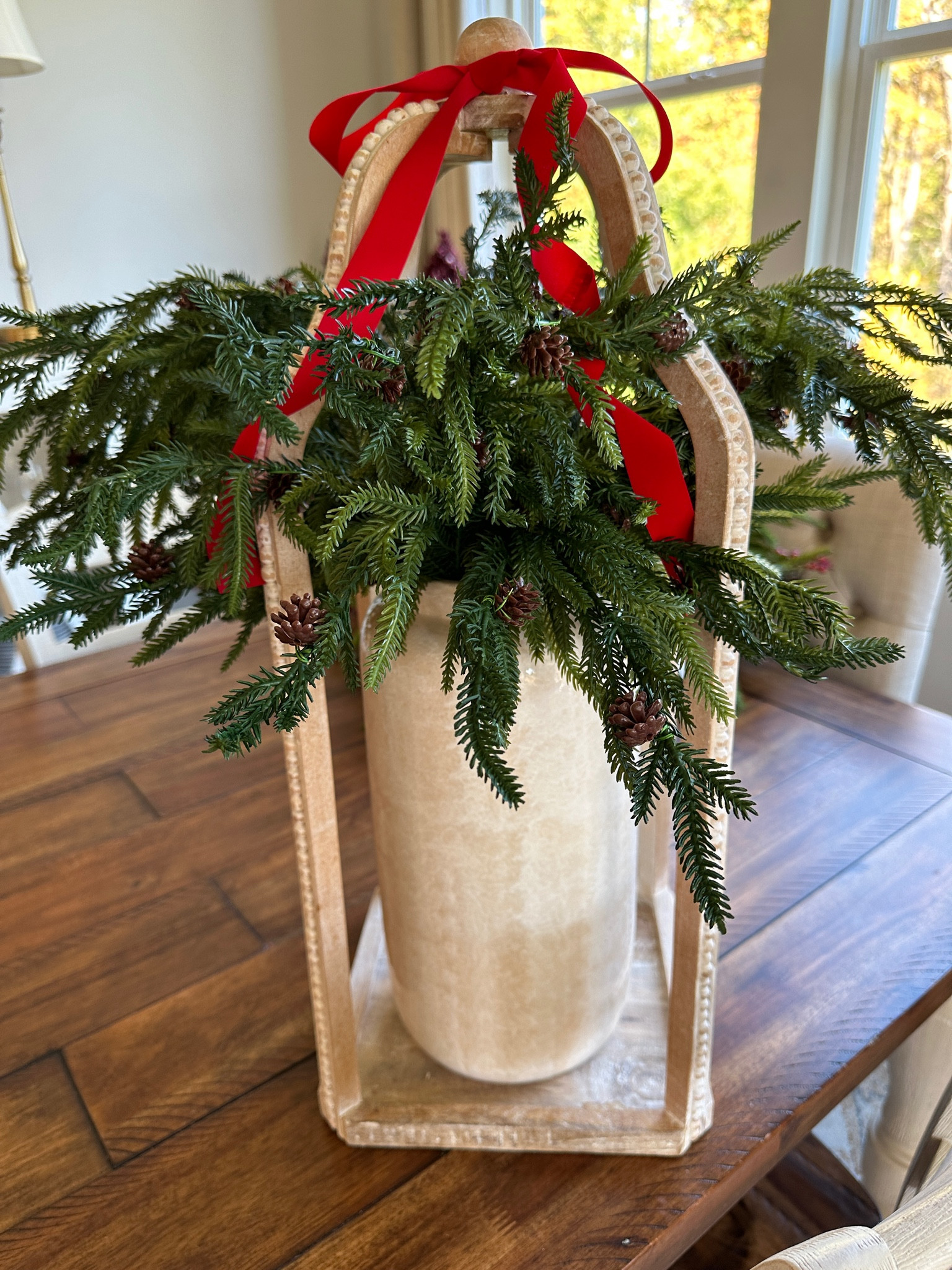 Norfolk pine stems lantern and red ribbon

#LTKhome #LTKHoliday #LTKHolidaySale