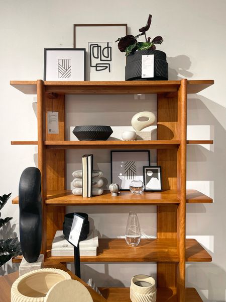 Shelf style elevated with the Otto wood bookcase from West Elm. Simple black & white modern decor completes the sleek look.  🖤🤎🤍

• mid-century modern 
• 5 open shelves to decorate 
• solid mango wood in acorn color

#LTKFindsUnder100 #LTKHome #LTKSaleAlert