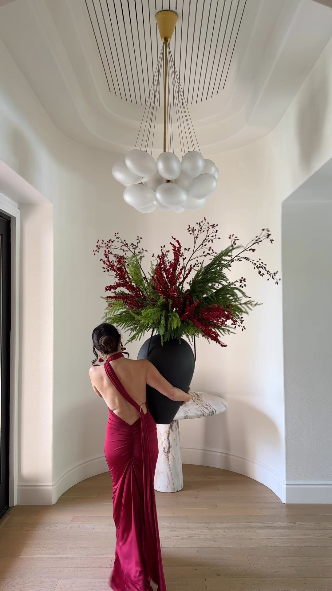 Holiday styling, red dress, berries, vase, candles
