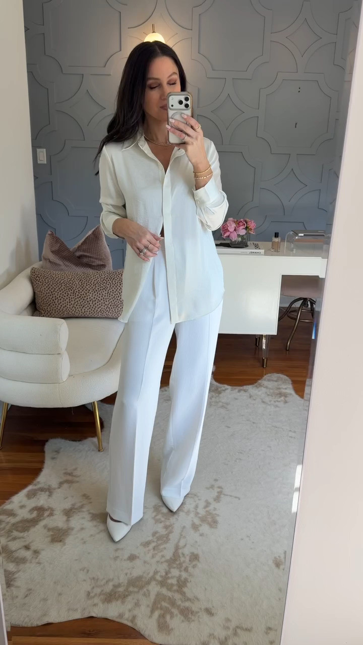 All-white never fails — this satin button-down and tailored trousers create a polished monochrome look perfect for summer events or the office. True to size in both pieces.

Aritzia Summer 2026 • Stylist Picks • Elevated Workwear 

 #LTKootd #LTKSeasonal #LTKOver40