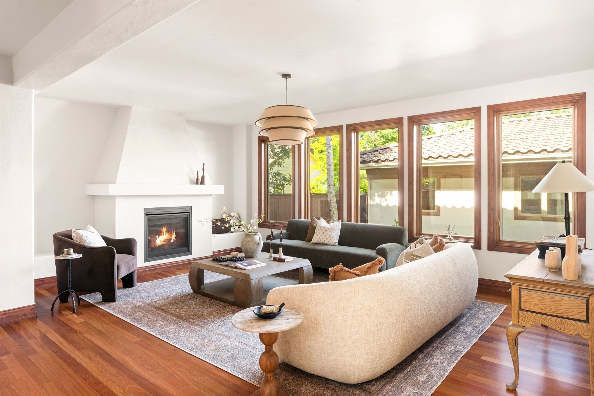 Spanish style living room with green sofa, wood coffee table, brown side chair and vintage rug. 

Living room, sofa, velvet, Spanish style, large coffee table, accent chair

#LTKHome