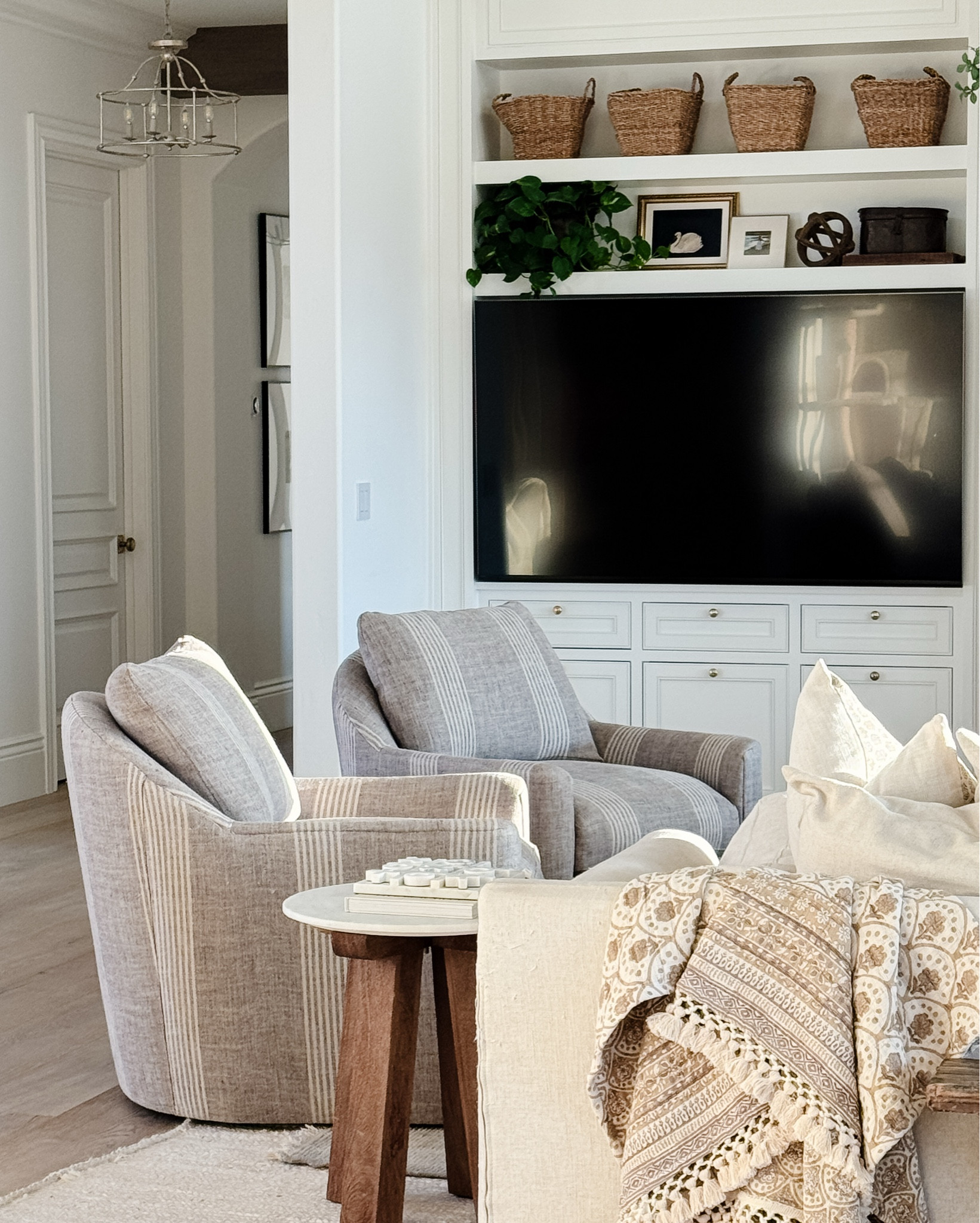 Our new swivel chairs have arrived!  I love the warmth they brought to this space and I love the added neutral pattern!  Linking my sofa, and decor in our family room!

#LTKFamily #LTKSaleAlert #LTKHome