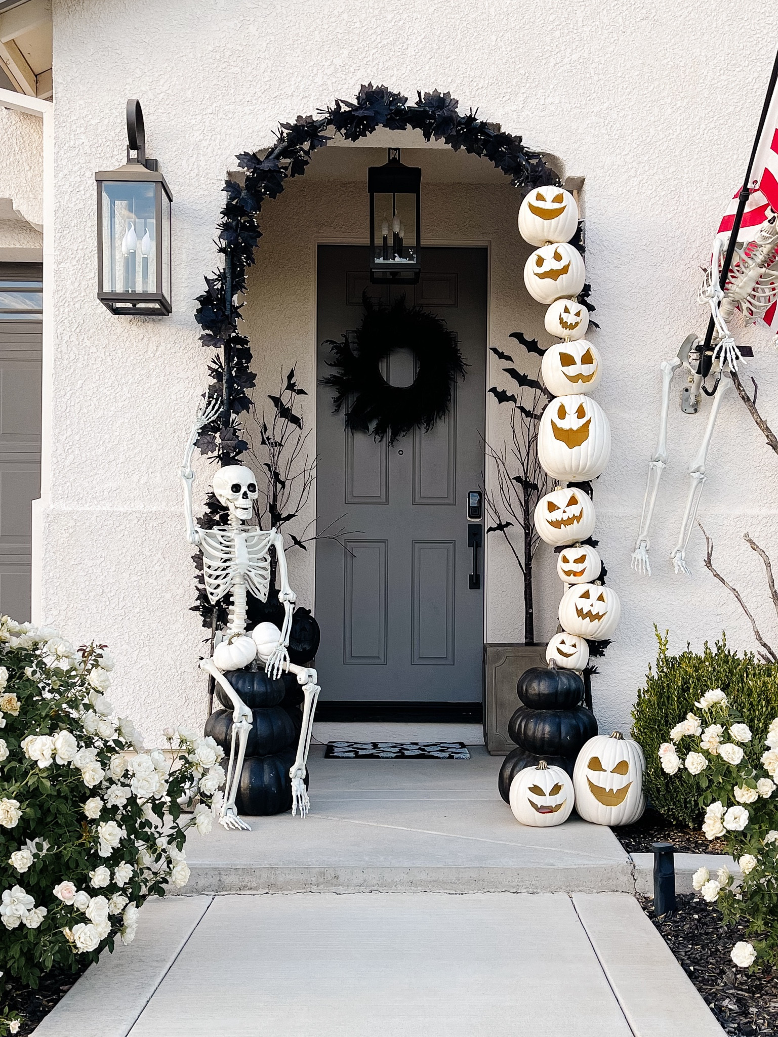 Halloween decor | Halloween pumpkin arch | diy Halloween decor | Halloween porch | white pumpkins; Skeleton decor; black grassy wreath; arch lights; black coach lights Sale

#LTKHalloween #LTKHoliday #LTKHolidaySale