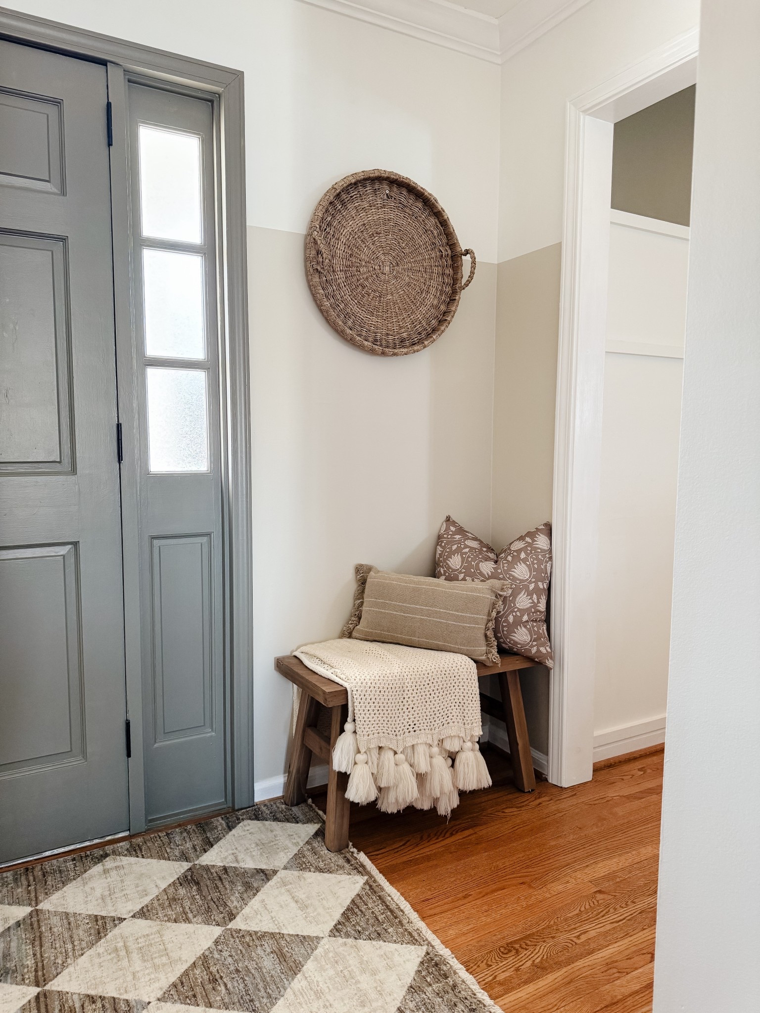 Small entryway 

Wooden bench 
Rug to ground the space
Throw blanket 
Pillows
Pillow insert 
Woven tray 
Painted door 

#LTKStyleTip #LTKFindsUnder100 #LTKHome