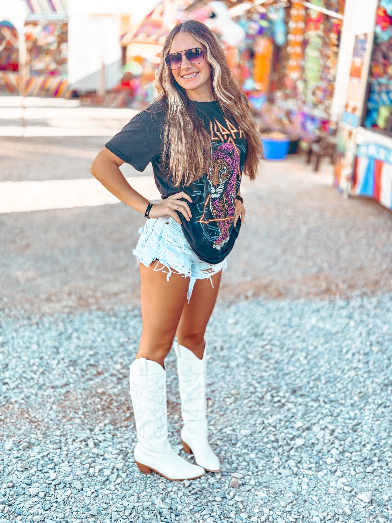 Fair fun cutie! Concert outfit, white boots, cowboy boots, graphic concert tee, denim cutoff shorts 

#LTKsalealert #LTKshoecrush #LTKstyletip