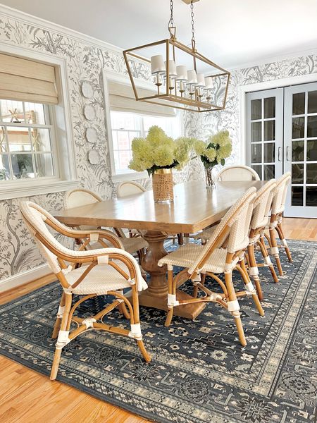 Grandmillennial blue and white kitchen rattan resin dining chairs riviera French style brown wood pedestal table linear lantern darlana bird and thistle Brunschwig and Fils wallpaper 

#LTKsalealert #LTKhome