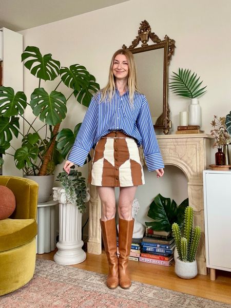 Oversized cotton button down shirt in blue, white stripe paired with a patchwork mini skirt and knee high riding leather boots ✨ Sezane Bilma shirt, Sezane Gwenda skirt and Madewell boots 