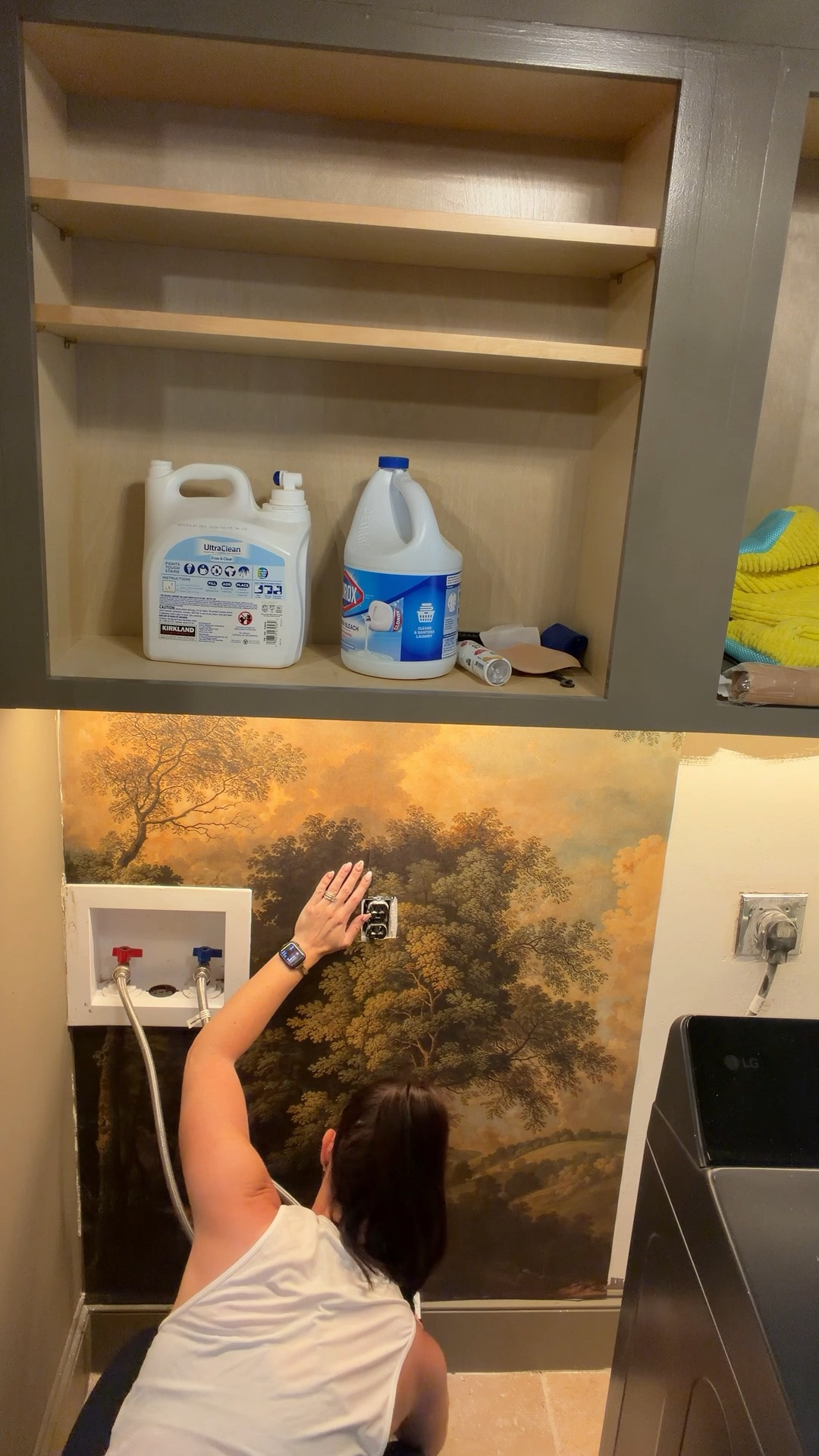 A little peek-a-boo wall mural in the laundry room! Wanted to add a pop of pattern to break up the darker solid colors and love how it turned out! Almost done with this project! Wall mural is from Wall Blush.

#LTKHome