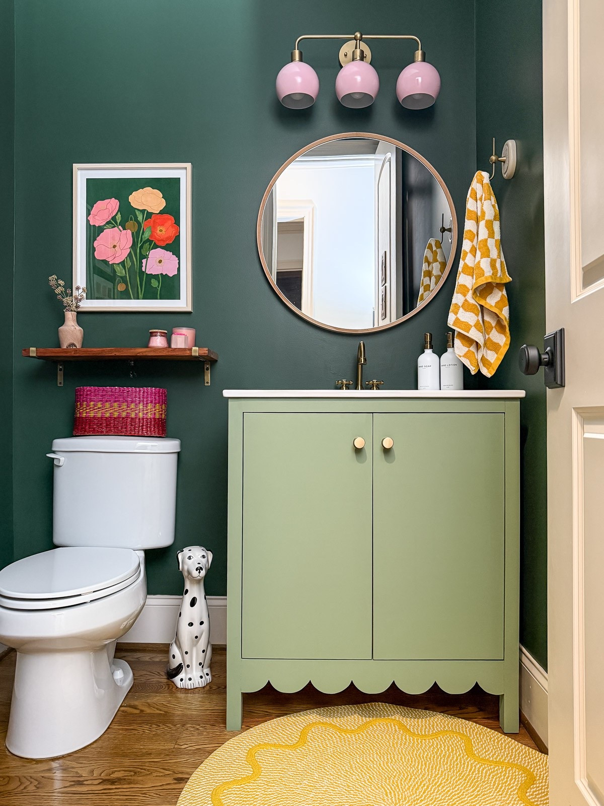 So happy with our colorful powder room makeover. I’ve linked what I can for you. The men and women plaques on the door are antiques that I found years ago. We built the scalloped vanity ourselves and DIYed the light, but I've linked the original inspiration pieces for you. Several of the art pieces are from independent artists and are no longer available. The paint color on the wall is Vogue Green by Sherwin-Williams. 

#LTKFindsUnder100 #LTKFindsUnder50 #LTKHome