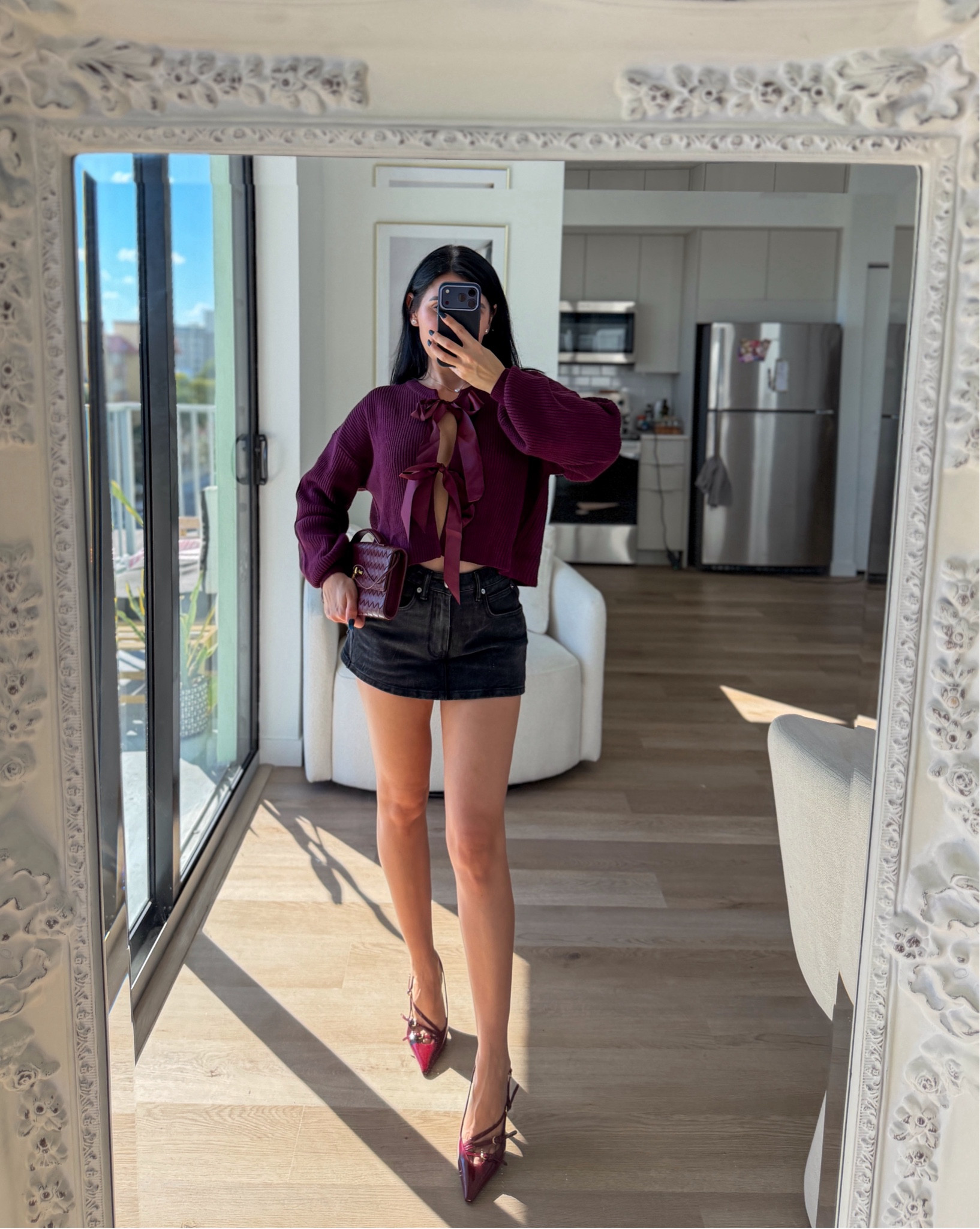 Burgundy bow knit sweater and jean skort 

#LTKootd #LTKFindsUnder100 #LTKHoliday