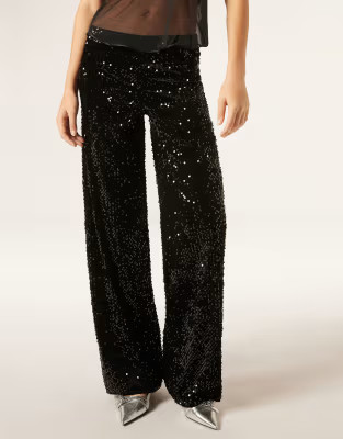 Calzedonia Velvet and sequin palazzo trousers in black | ASOS (Global)