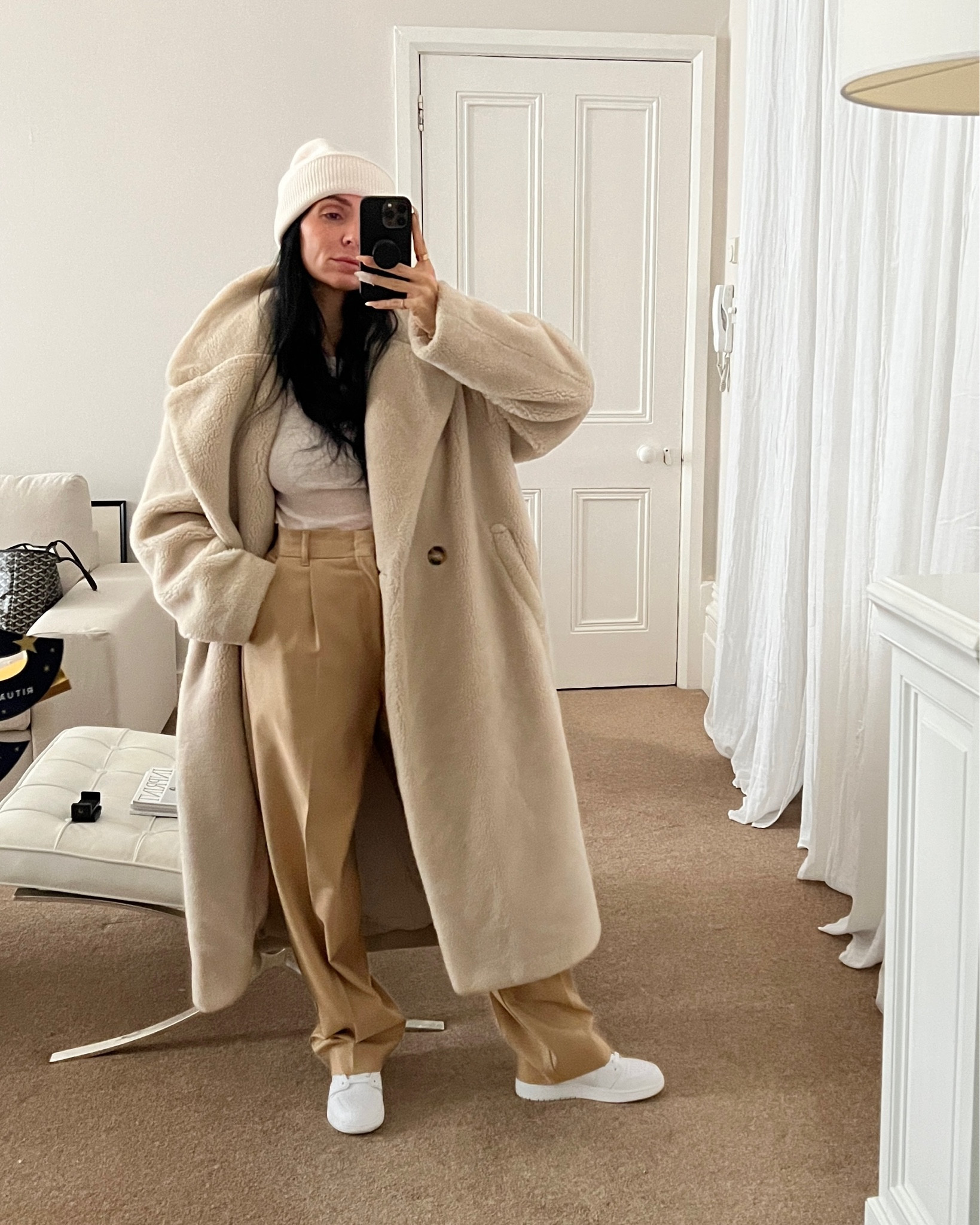 Donna Bartoli from donnabartoli.com wears a cozy winter outfit. Teddy coat, cashmere beanie, tailored trousers, long sleeve wool top, white high-top trainers. Exact teddy coat is sold out but similar ones are listed 

#LTKeurope #LTKSeasonal #LTKfit