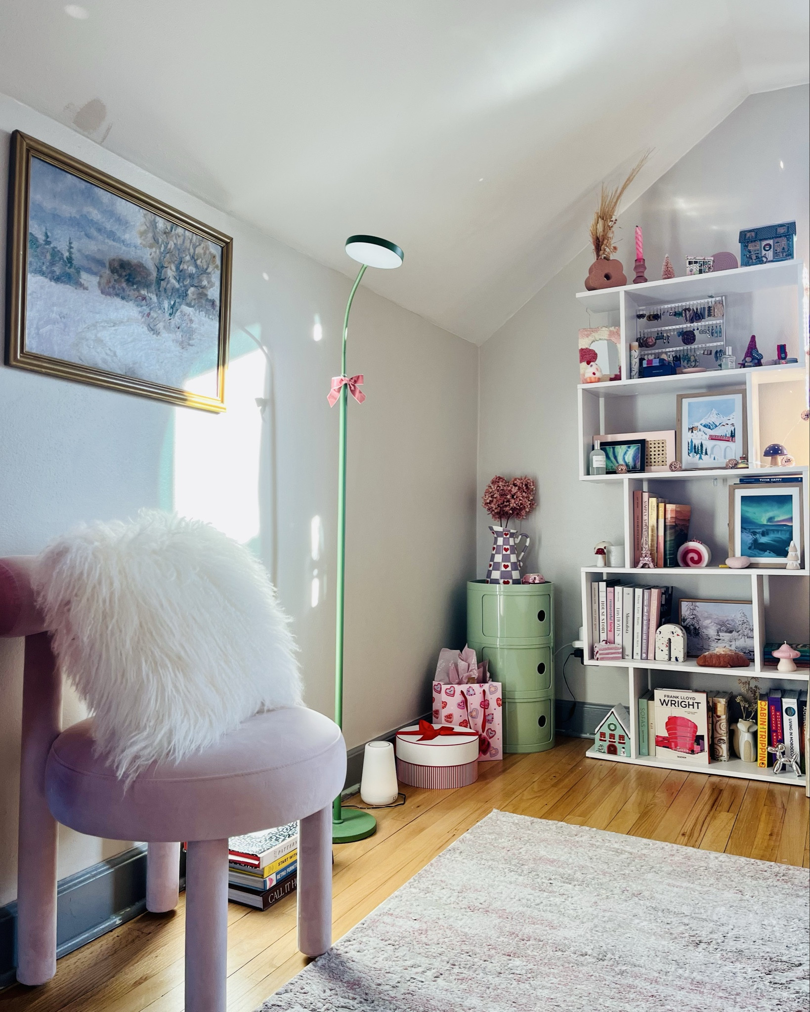 Cosy bedroom views! When the weather outside is frightful, you do “hygge” (cosy) inside the Danish way! Bookshelf styling, books, home decor, componibile storage unit, blush accent chair, fluffy pillow. 

#LTKSeasonal #LTKHome #LTKStyleTip