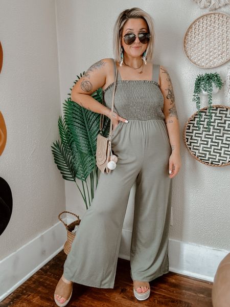 Vacation jumpsuit outfit! Stretchy comfortable flowy green jumpsuit (small/5’1 wearing a platform sandal) — the green is more of a sage green! Paired with straw Pom Pom tassel beach purse and straw cork espadrilles platform sandals and colorful tassel beaded earrings. 

#LTKU #LTKstyletip #LTKSeasonal