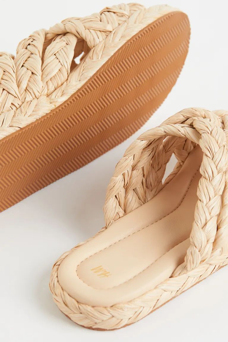 Slides in braided straw with open toes and crossover foot straps. Faux leather insoles and fluted... | H&M (US)