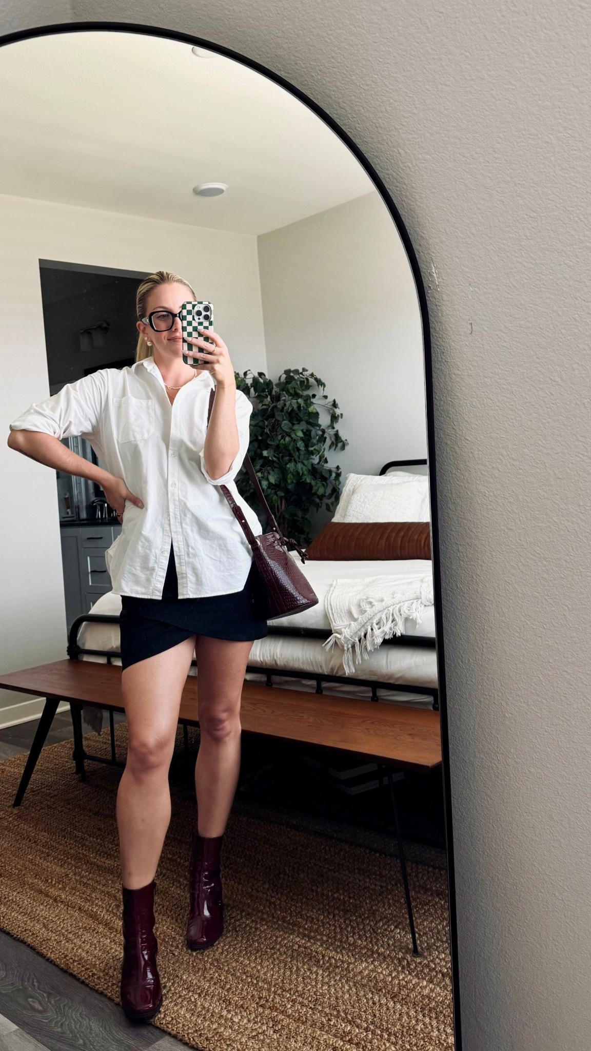 date night summer outfit 🤍🤍 black asymmetric skirt, white oversized button down, and maroon ankle boots paired with my maroon sezane bucket bag. definitely feels summer to fall transitional, right?? 🥰

#LTKSeasonal #LTKItBag #LTKStyleTip