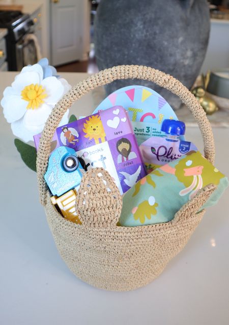 Easter basket ideas for toddlers! Cute raffia handmade small Easter basket, perfect for little ones! Toy trucks, Easter t shirt, Easter board books 

#LTKSeasonal #LTKbaby #LTKkids