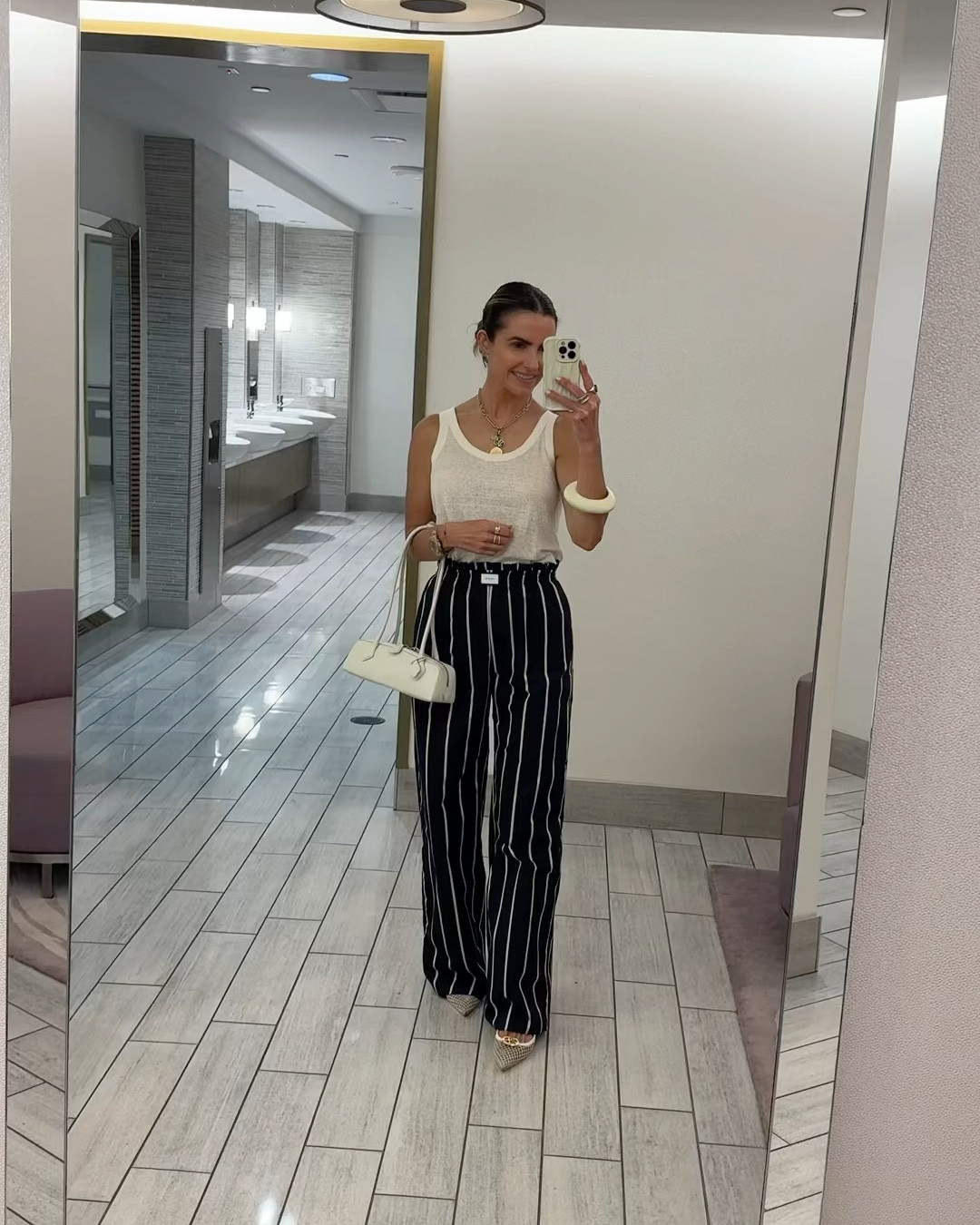 wearing the perfect summer look for a nostalgic lunch today w the fam at downtown neimans marcus zodiac room before they sadly close the doors (i’ve heard in dec for good)🤍

wearing a fab pair of pants im obsessed w (+ linked other chic favs too) 

& not your basic off-white tank, bracelet of the summer, chic bag & kitten heels as well! 

pants & tank run tts wearing small in both  

#LTKStyleTip #LTKFindsUnder100 #LTKWorkwear