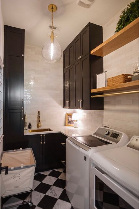 Laundry room decor and organization. We renovated this laundry room and added a marble checkerboard floor, organic white subway tile backsplash, floating shelves and lots of storage! We love our laundry cart, brass sink, brass kitchen faucet and pendant light. 


#LTKHome #LTKStyleTip