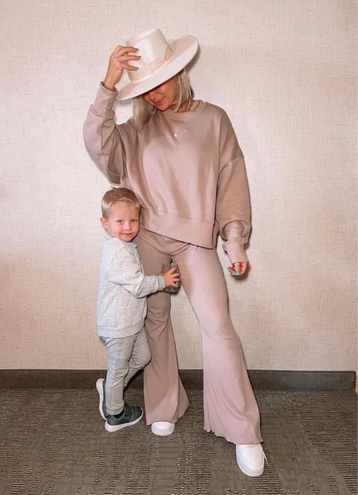 The best #AirportOutfit — wearing a size small in this cropped Nike pullover. Wearing a size medium in these ribbed flares. Code TANNER for $$ off my hat #nike #traveloutfit 

#LTKtravel #LTKbump