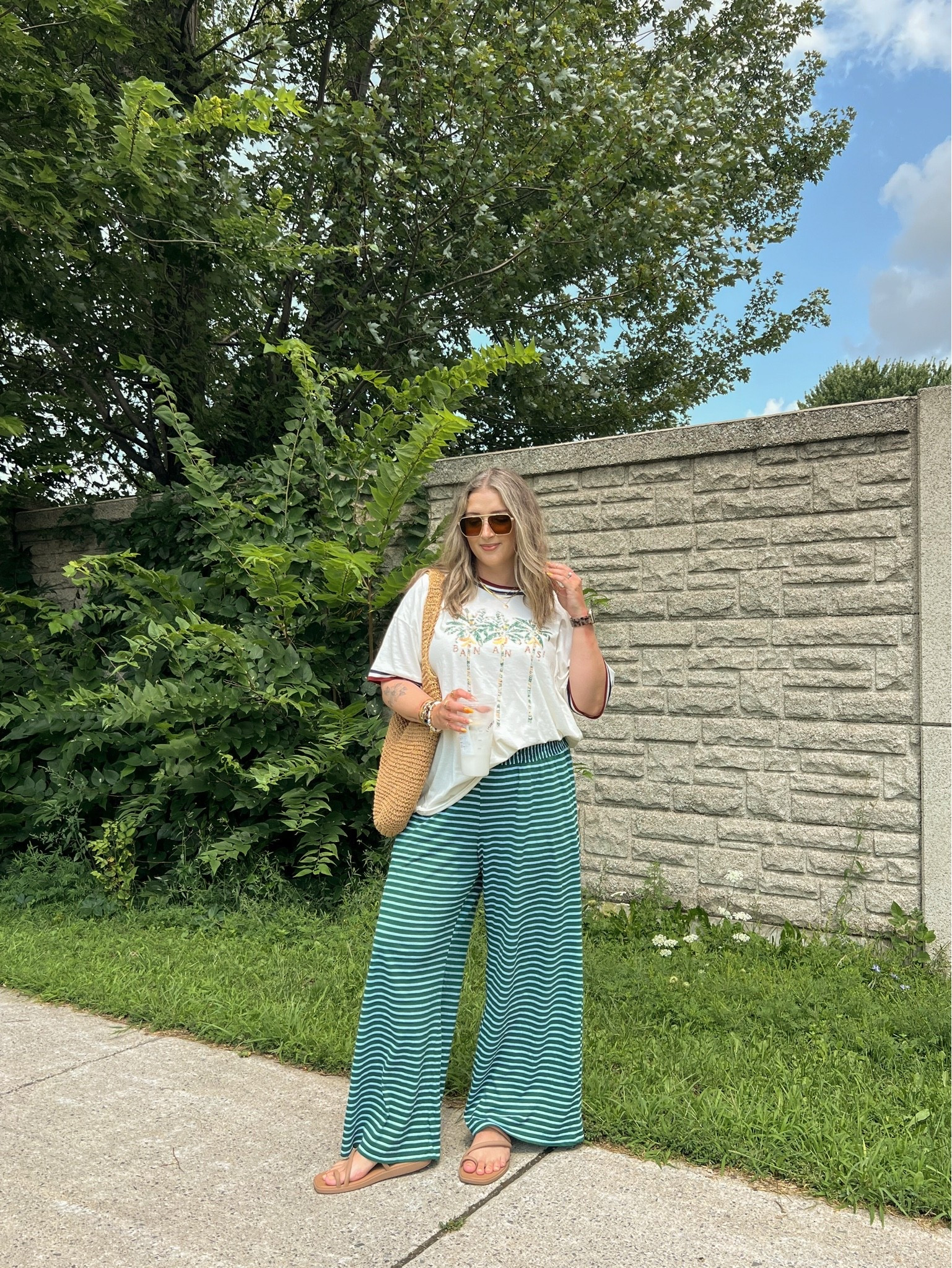 Comfy casual summer outfit! Wearing my usual size L in both the striped wide leg pants and graphic tee! Crocs sandals are super comfy, I’m a 9.5-10 shoe and wear a 10. Canadian crocs link under “similar products”

#LTKsummer #LTKsale #LTKmidsize