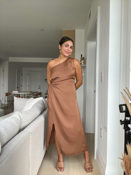Calling all of my chic neutral loving girls, I found the perfect wedding guest dress for you! 🤎 I typically don’t love satin dresses because they tend to show every crevice of your skin, but this satin is amazing and sooooo flattering. It’s more like a shift dress and isn’t skin tight. You can also adjust the tie on the side to show as much as you want. I’m wearing a medium, which is my typical size and it fits perfectly! 

#LTKFind #LTKwedding #LTKunder50