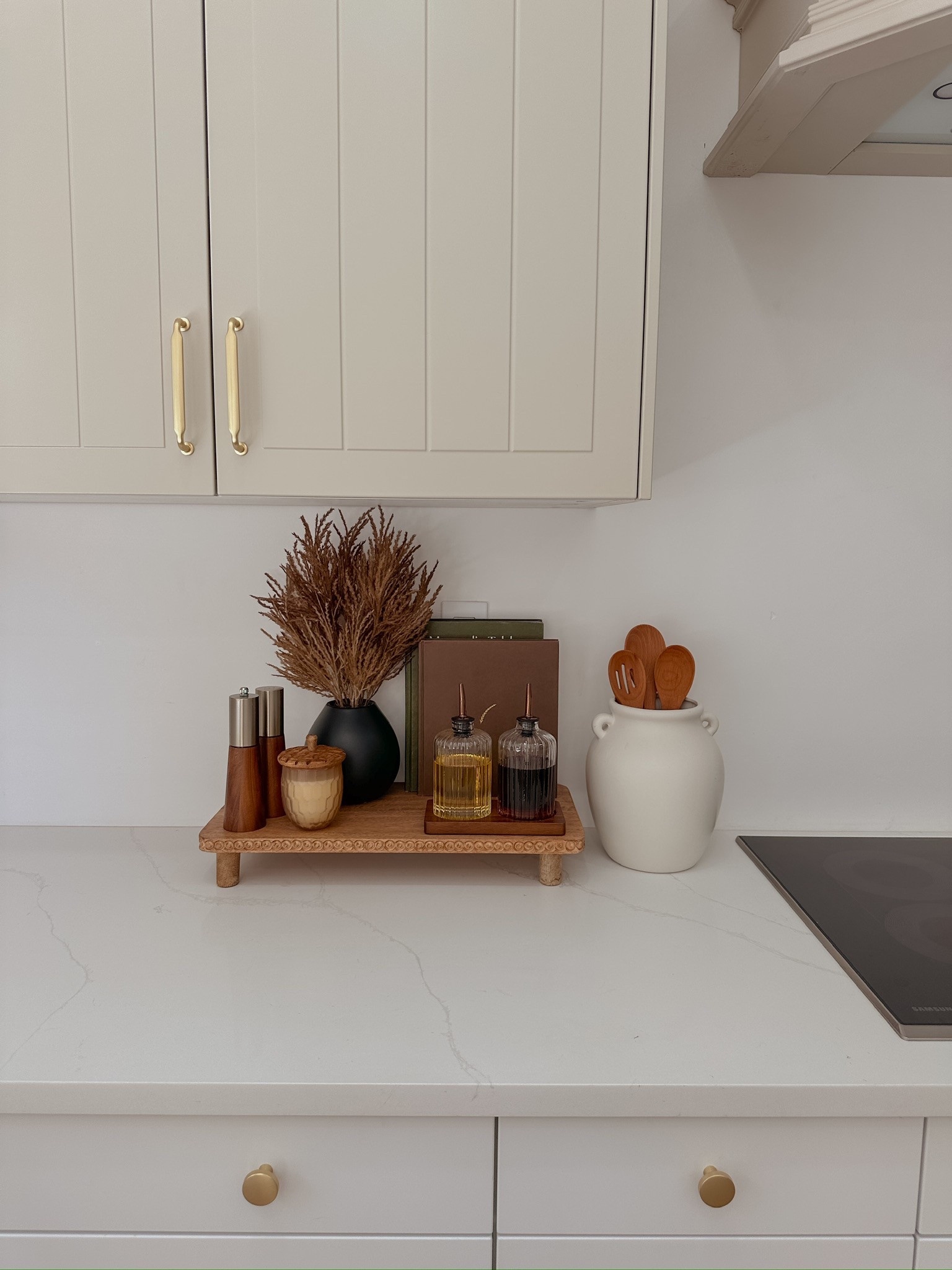 Kitchen counter styling moment 🤍 I created a little corner next to the stove with a wooden riser, olive oil + vinegar dispensers, and some neutral vases for a simple, functional setup. The riser and vases are thrifted, but I found similar options you can shop! A pretty and practical way to style your everyday essentials. #KitchenCounterDecor #ThriftedFinds #NeutralKitchenStyle #LTKhome #LTKkitchen #OliveOilDispenser #WoodRiser #KitchenVignette #HomeDecorInspo #FunctionalDecor



#LTKStyleTip #LTKHome #LTKFindsUnder50
