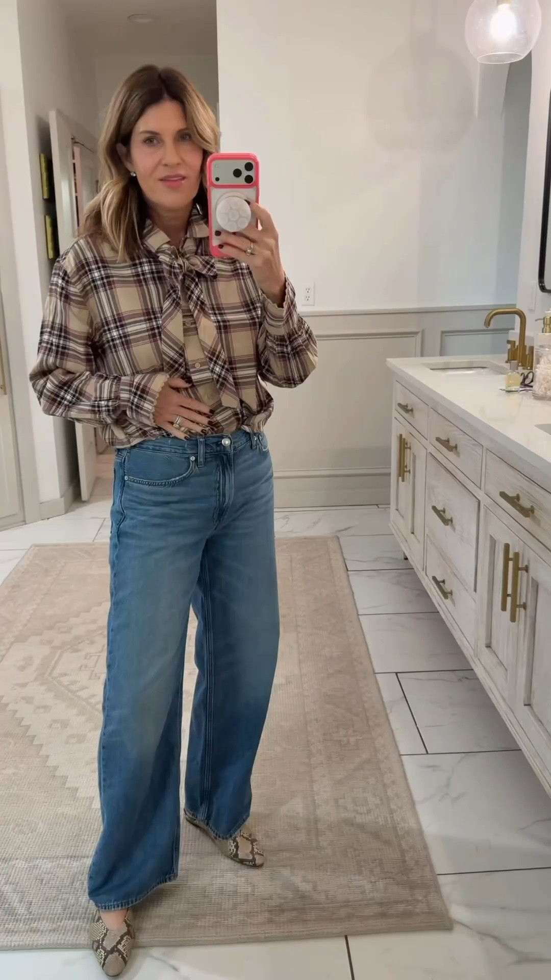 Wearing a size small in this cute plaid flannel bow top from Walmart