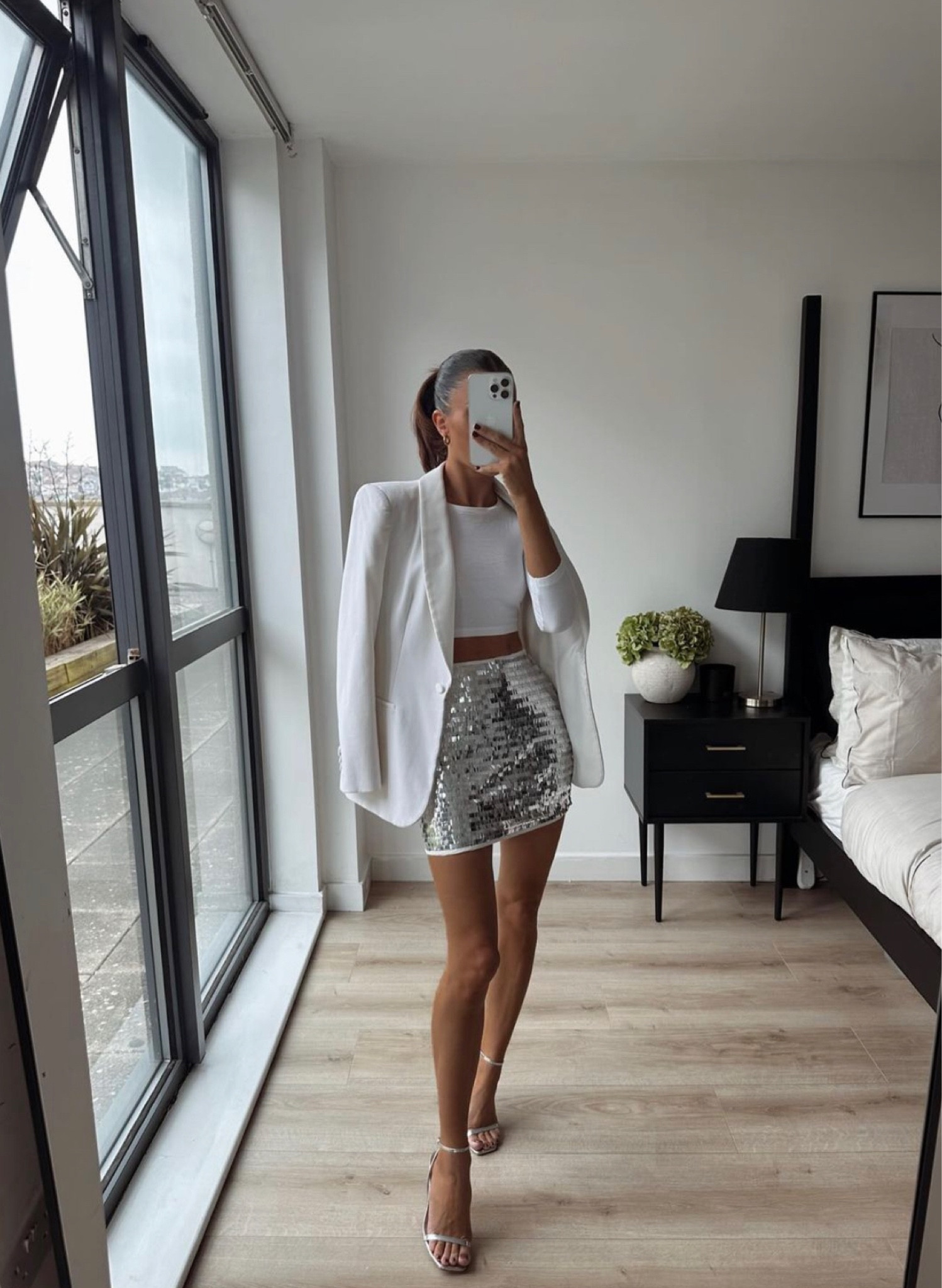White blazer, crop top, glitter silver skirt, silver heels 

#LTKparties #LTKSeasonal #LTKeurope