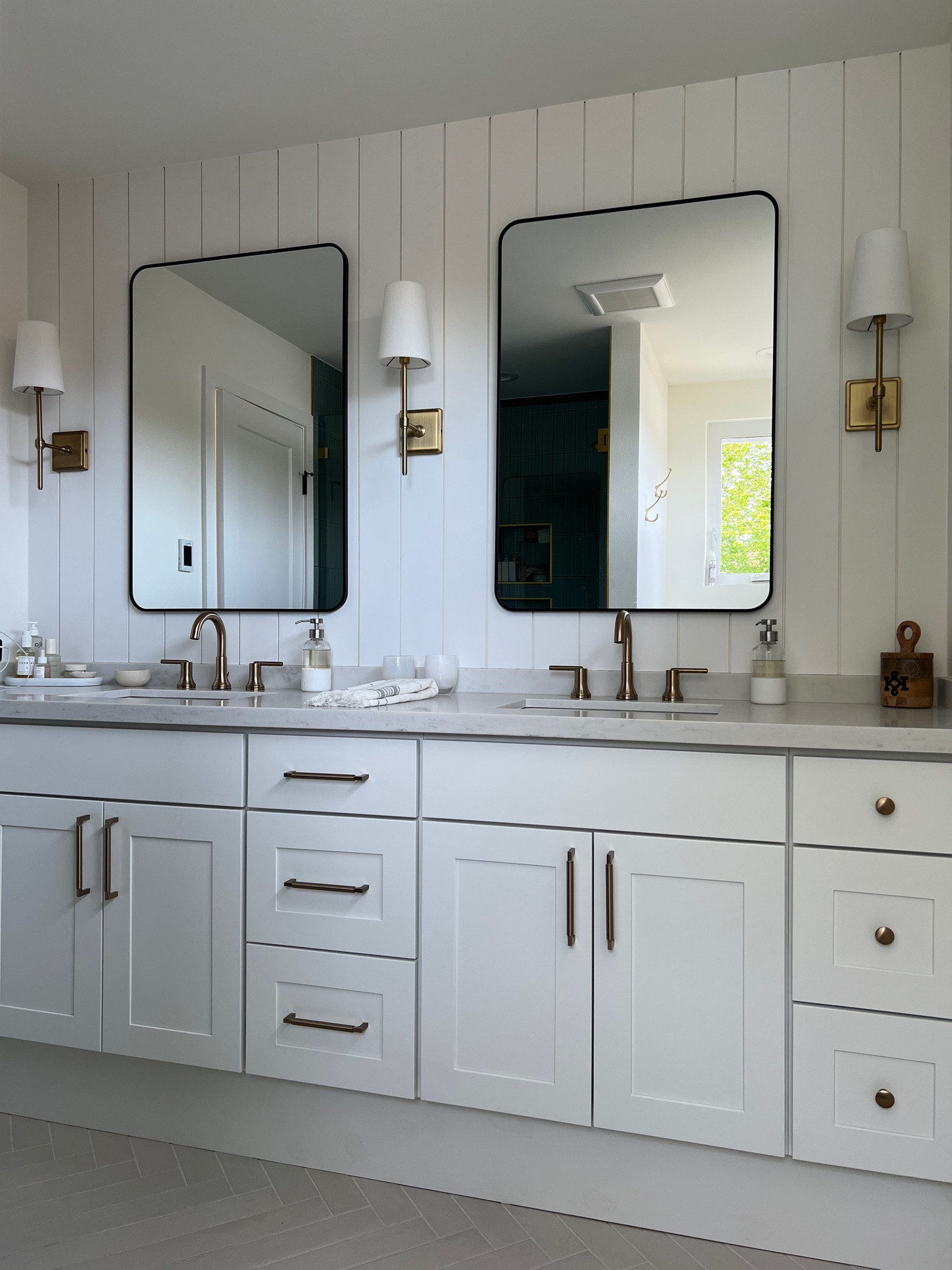 Primary bath 💛

Vertical shiplap with black mirrors in 30x36  (measure to your space) & 3 sconces in tumbled brass. 

Liberty hardware in champagne bronze (sold at a few stores) 

#LTKhome