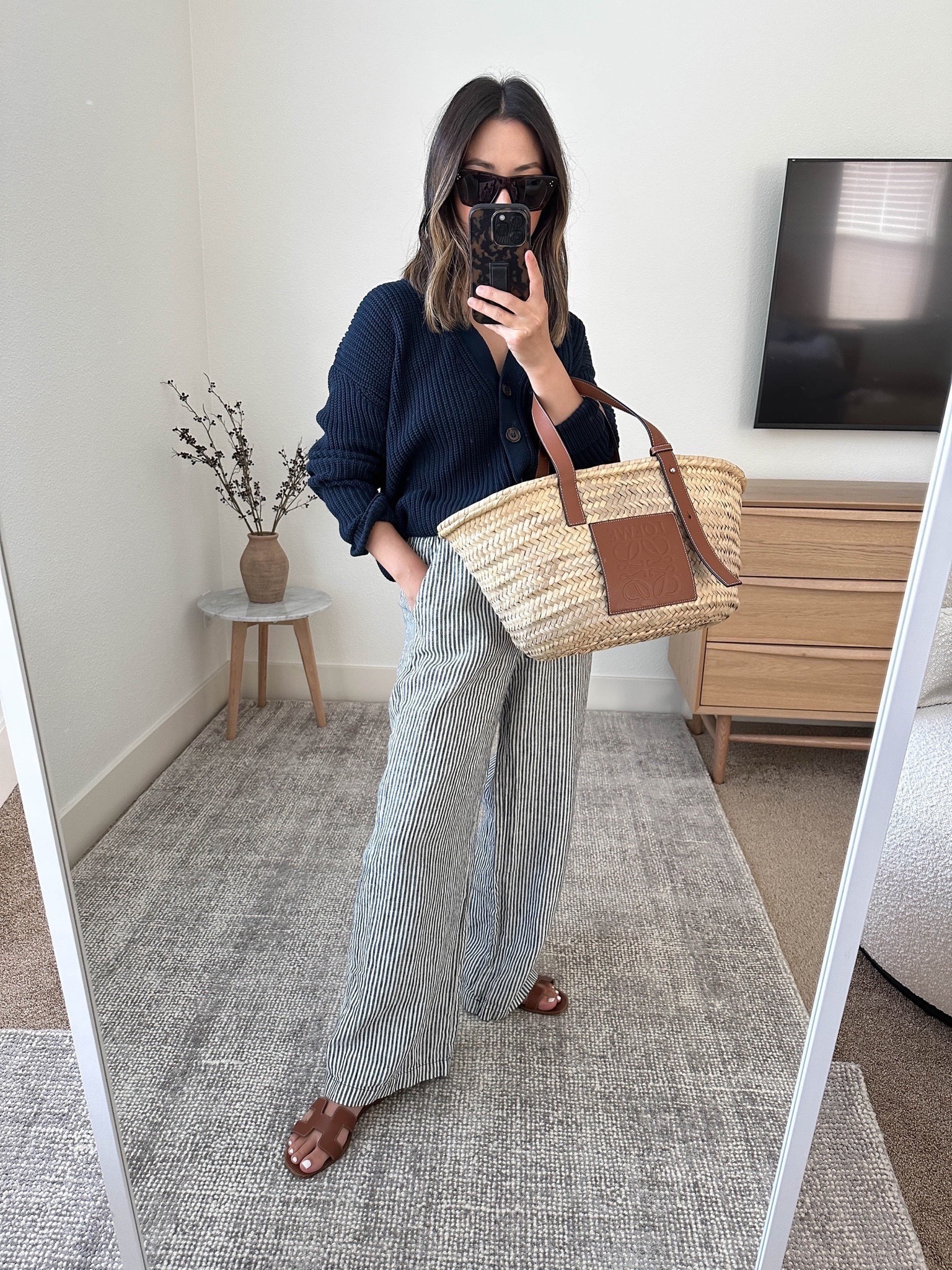 My Reformation linen pull on pants. These are the regular. They have pockets! Slightly long with a was and dry but still work. Love this striped print. 

Jenni Kayne cotton cropped cocoon cardigan xs (color is sold out)
Reformation pants xs
Hermes Oran sandals 35
Loewe tote Medium
Celine sunglasses  

Sandals, petite style, petite linen pants, vacation outfits, resortwear

#LTKshoecrush #LTKSeasonal #LTKitbag