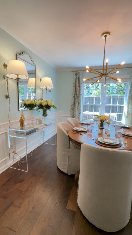 Modern classic dining room design with Ballard Designs linen slipcover chairs, acrylic console table, plug-in sconces, modern gold chandelier, and blue-green paint color, dining room style, interior design inspo, traditional interior

#LTKhome #LTKstyletip