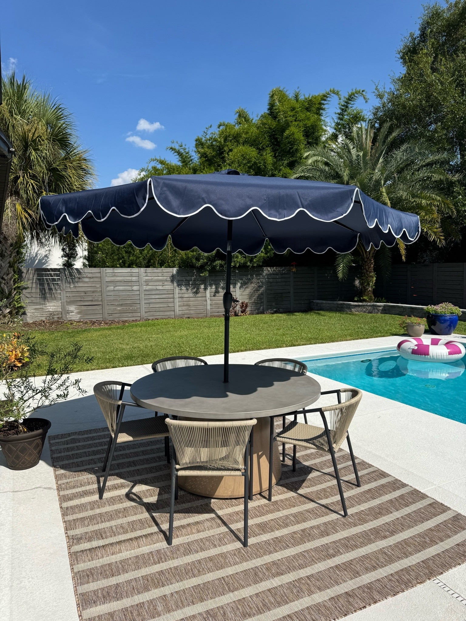 Our new scallop navy blue umbrella, stripe outdoor rug and chairs!

#LTKSaleAlert #LTKHome #LTKOver40