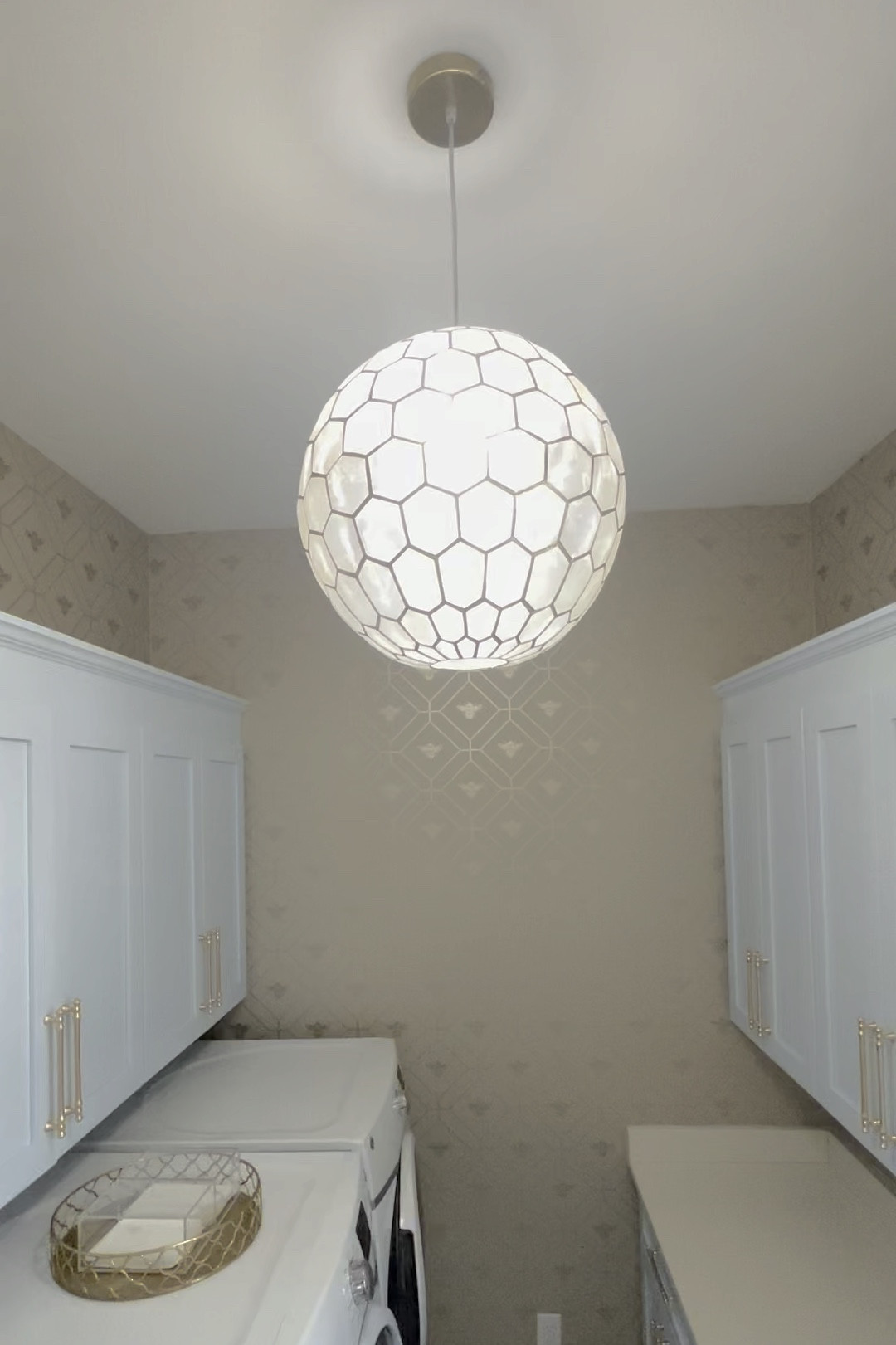 Sneak peek at my laundry room.
Love this honeycomb patterned light and acrylic organizers for laundry detergent sheets and dryer sheets!

#LTKFindsUnder50 #LTKWatchNow #LTKHome