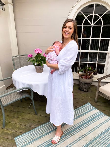 Loving this comfy gauze white midi dress! On SALE for $28! Perfect for postpartum or even pregnant. Smocked waist and stretchy neckline plus buttons make it very nursing friendly! *Wearing size small. 

Bump friendly. Postpartum. Nursing friendly. Gauze dress. Midi dress. Pearl sandals. 

#LTKbump #LTKunder50 #LTKbaby