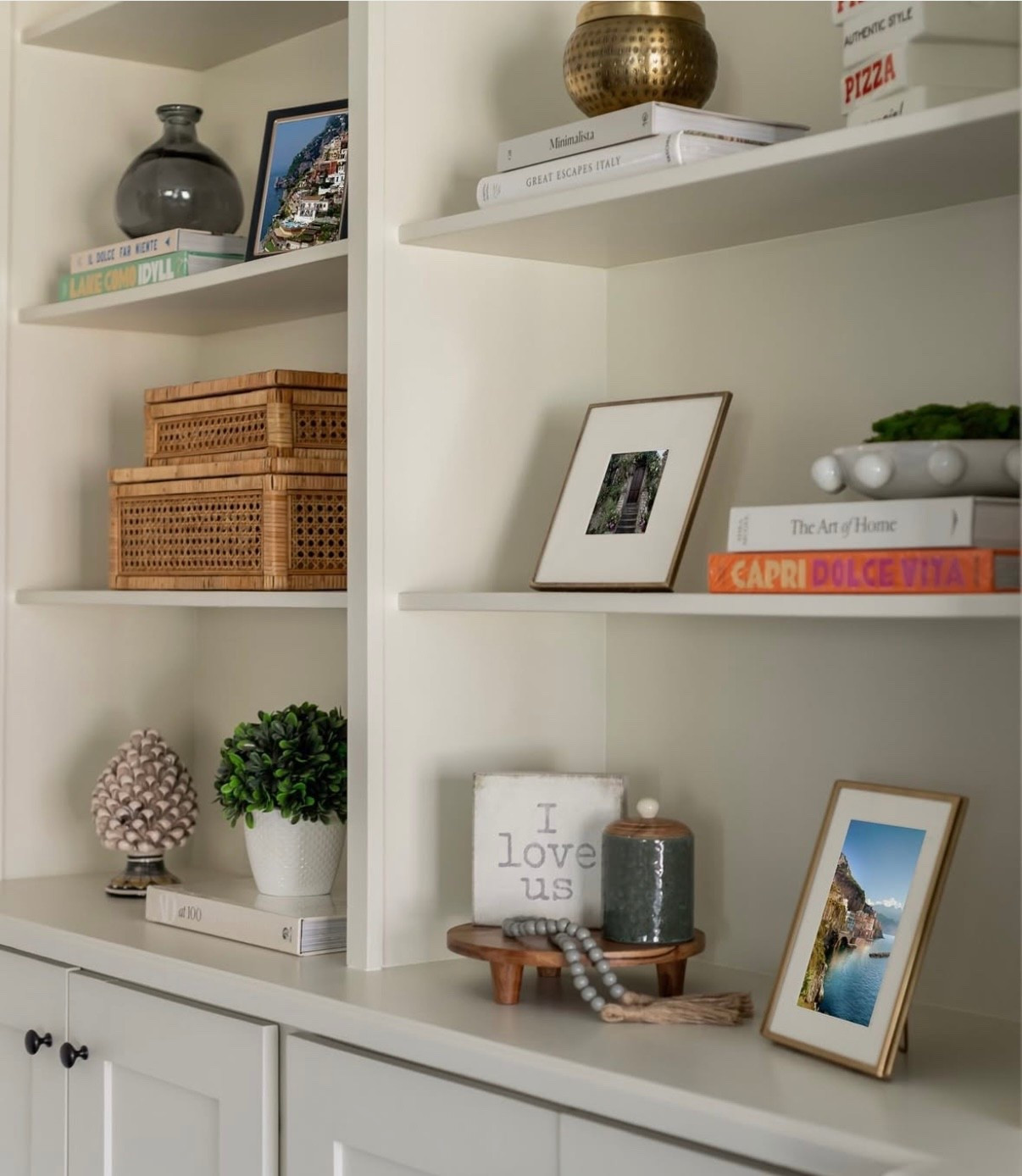✨ Shelf styling made simple ✨ A mix of travel books, woven textures, greenery, and personal touches (like framed photos + a sweet love note) keep this bookcase feeling layered, warm, and personal without being cluttered. 

#LTKStyleTip #LTKU #LTKHome