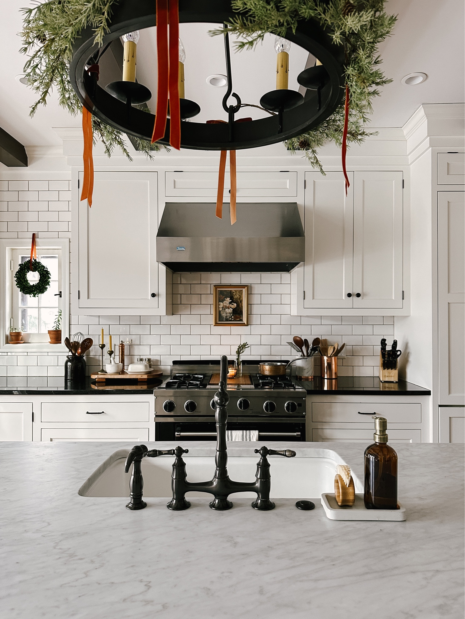 christmas kitchen. garland, velvet ribbon, preserved boxwood wreath, soap pump, copper pepper mill, vegetable cleaning brush  

#LTKHoliday #LTKhome