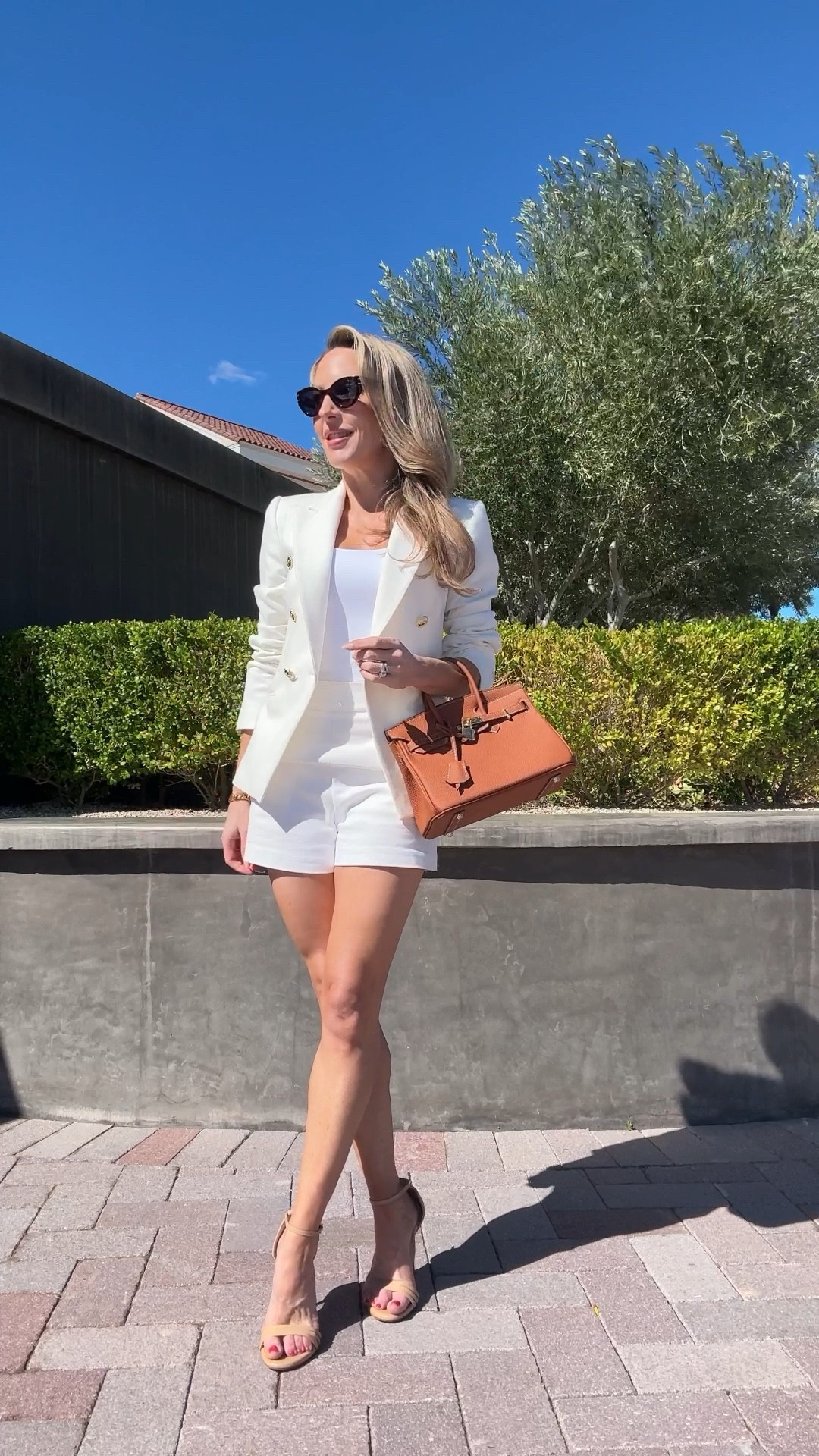 Name a more classic summer outfit combination than white shorts and a double breasted, gold button white blazer. Love a tan top handle bag and matching tan strappy sandals to keep it light and fresh. 

#LTKstyletip #LTKVideo #LTKSeasonal