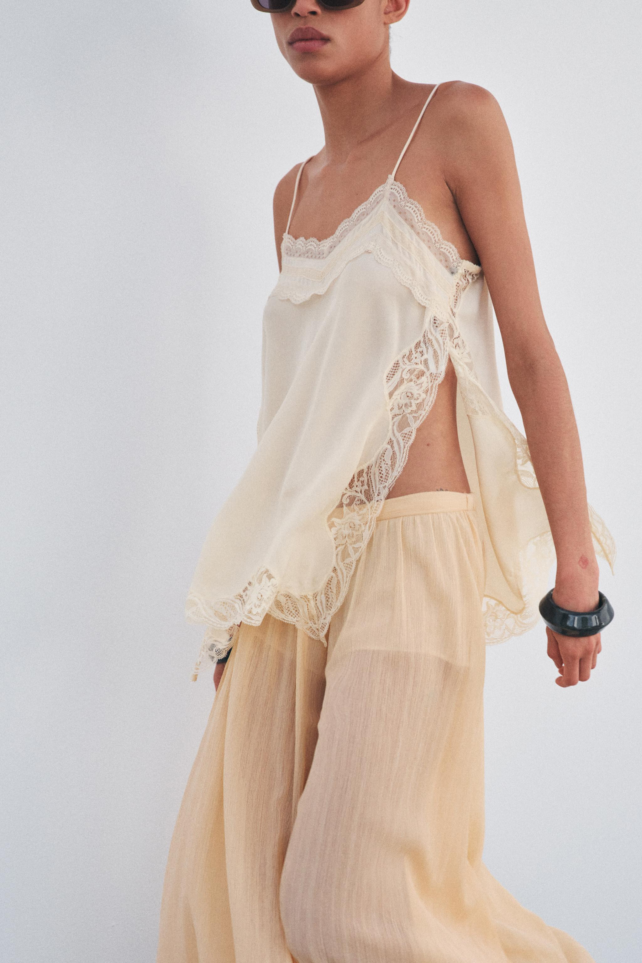 ZARA WOMAN COLLECTIONRound neck top with spaghetti straps. Tonal lace appliqué. Side slit hem. | Zara US