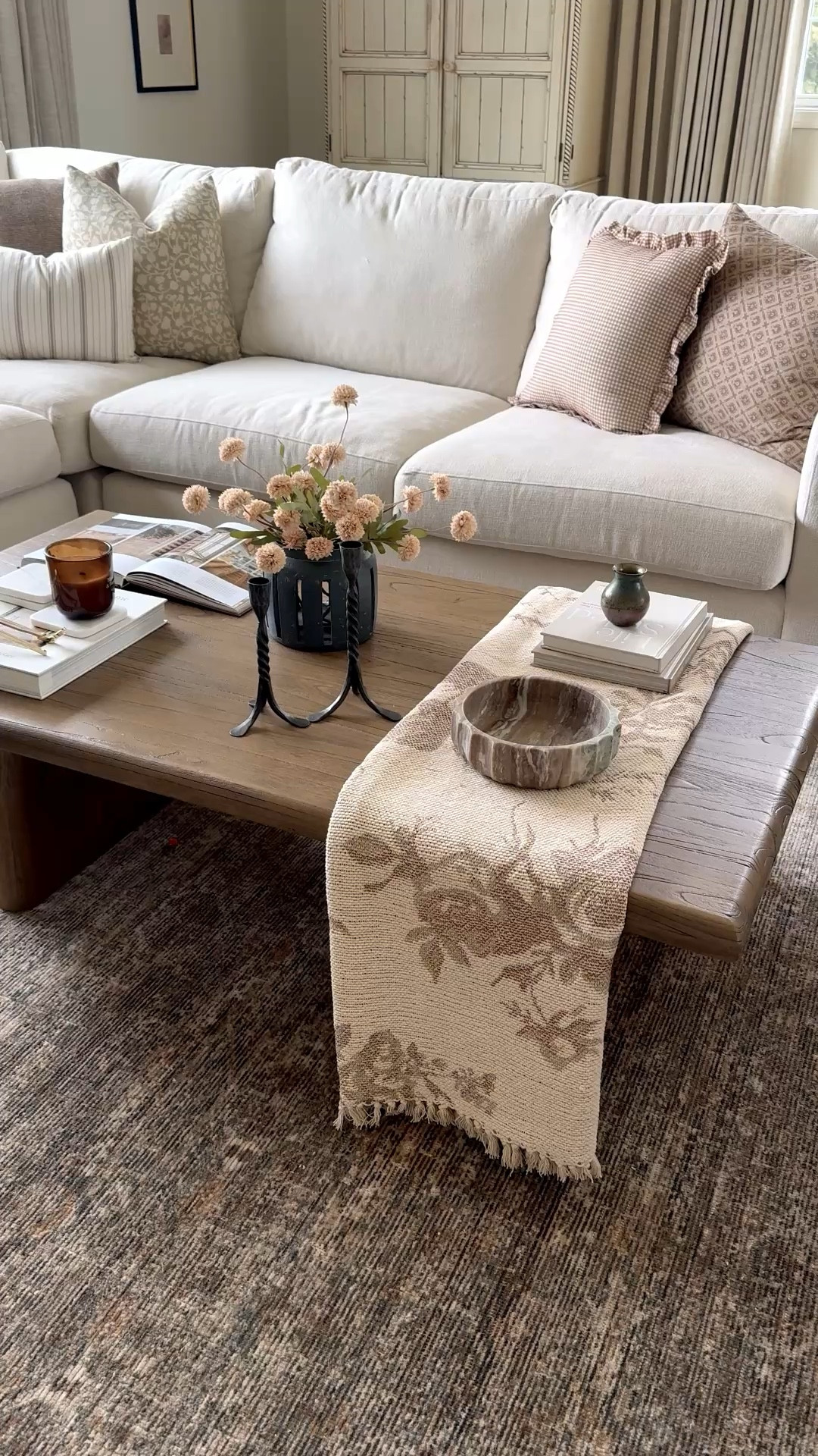 Coffee table refresh for spring! I incorporated this gorgeous throw. I got at target with some styling books, a beautiful vase with florals and marble bowl candlesticks and a candle.

#LTKHome #LTKSeasonal