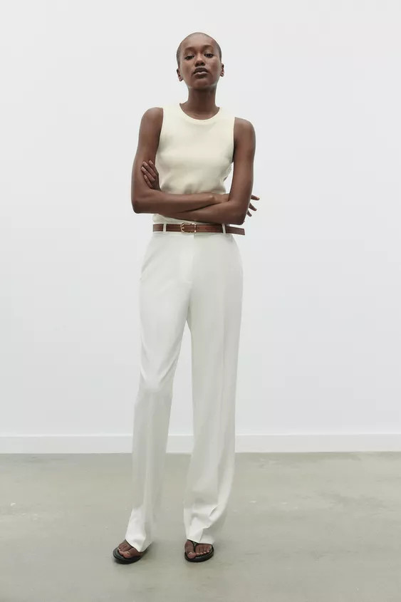 High-waist trousers with a belt. Front pockets and false flap pockets at the back. Straight leg. ... | Zara UK