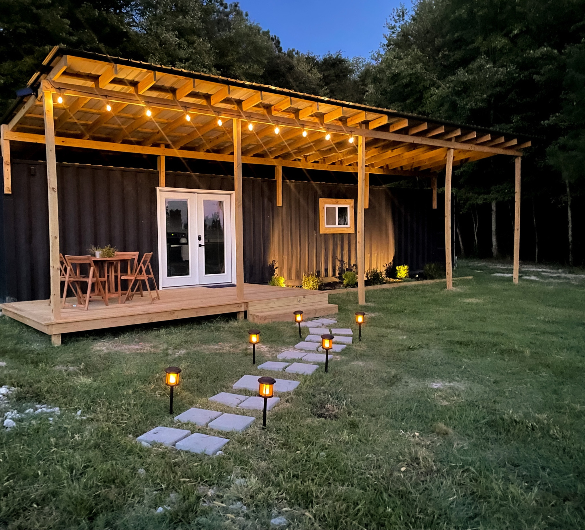 Our shipping container home exterior. The lights are a total vibe.

#LTKhome