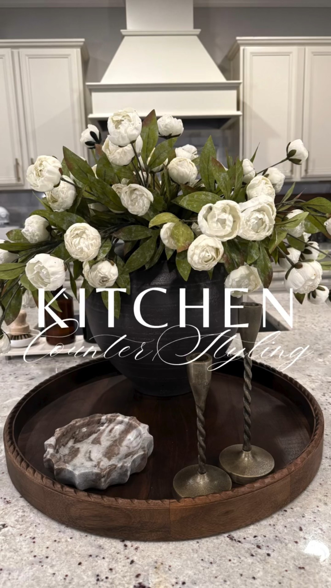 Spring kitchen centerpiece styling 🌸🤍
I’m refreshing my kitchen counter with pieces from the new Threshold x Studio McGee spring home decor at Target and I’m officially obsessed.

From the scalloped wooden round tray, twisted taper candleholders, and scalloped marble trinket dish to my viral faux peonies (yes… the ones that keep selling out 😅🌸) styled in this stunning ceramic vase—this centerpiece instantly elevated the entire space.

Pro tip: if the peonies are sold out again, I’ve linked the best similar options too so you don’t miss out ✨

Follow along for more affordable spring home decor, Target finds, and easy styling ideas 🤍

#homedecor #springdecor #targetfinds #targethome #studiomcgee #thresholdstudiomcgee #homestyling #interiorinspo #decorinspo #springhome #kitchendecor #neutralhome #kitchencounterdecor #springcenterpiece #fauxflorals #fauxpeonies

#LTKSeasonal #LTKHome #LTKFindsUnder50
