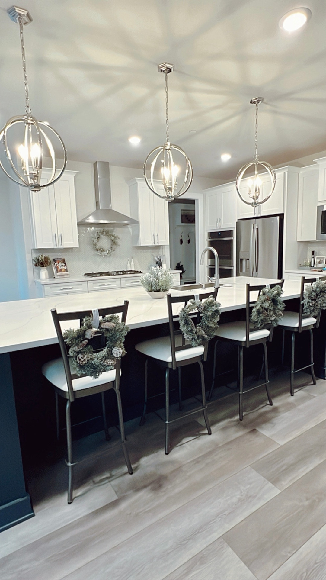 Easy Christmas Decor for your Home during the Holidays! 🎄 Hanging mini wreaths with velvet ribbon is a simple, easy, + affordable way to cozy up your space for the holidays! In the kitchen, try hanging these mini wreaths from the barstools or cabinets using wired ribbon. This could be done with festive colored ribbon, however, I chose a more neutral white + silver ribbon to match the flocked wreaths. 

#LTKSaleAlert #LTKHome #LTKHoliday